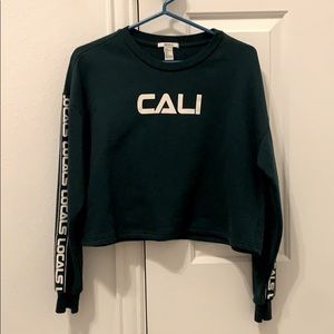 a green cropped sweater